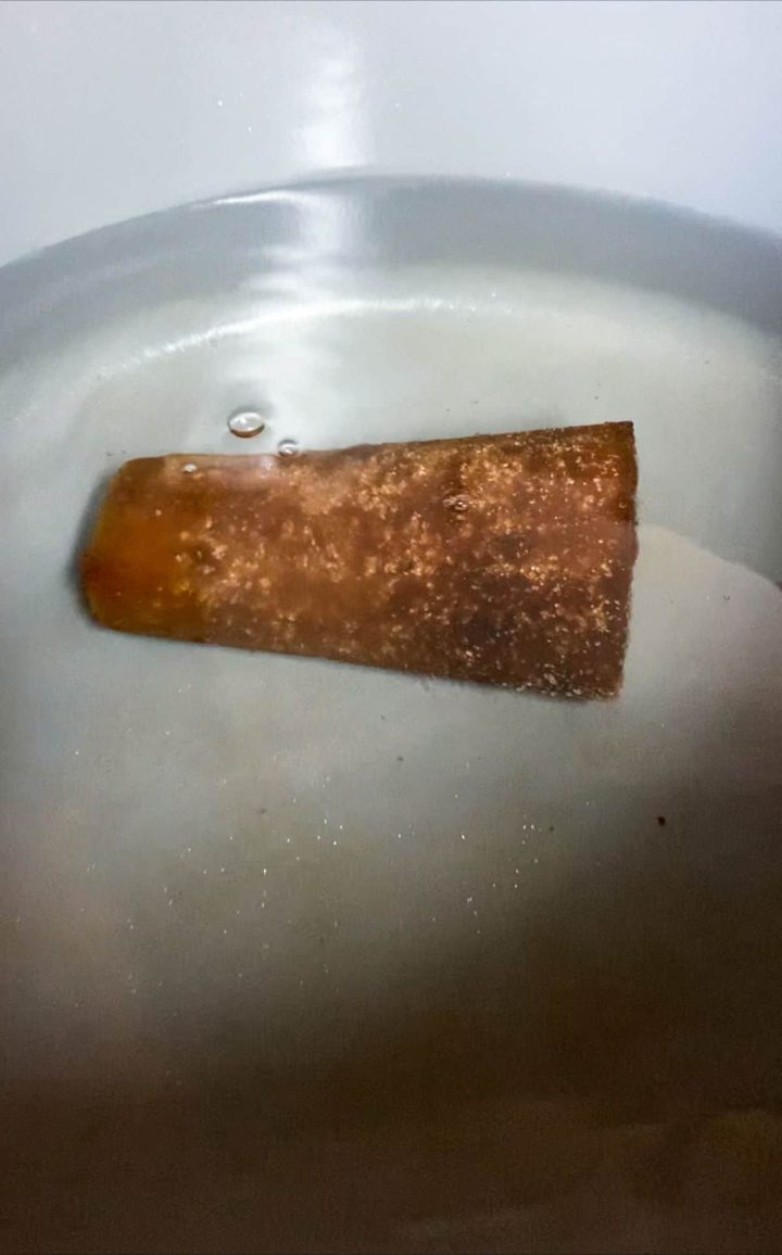 Pot of water with a cone of piloncillo