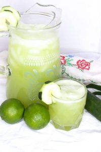 Pitcher and glass with cucumber agua fresca