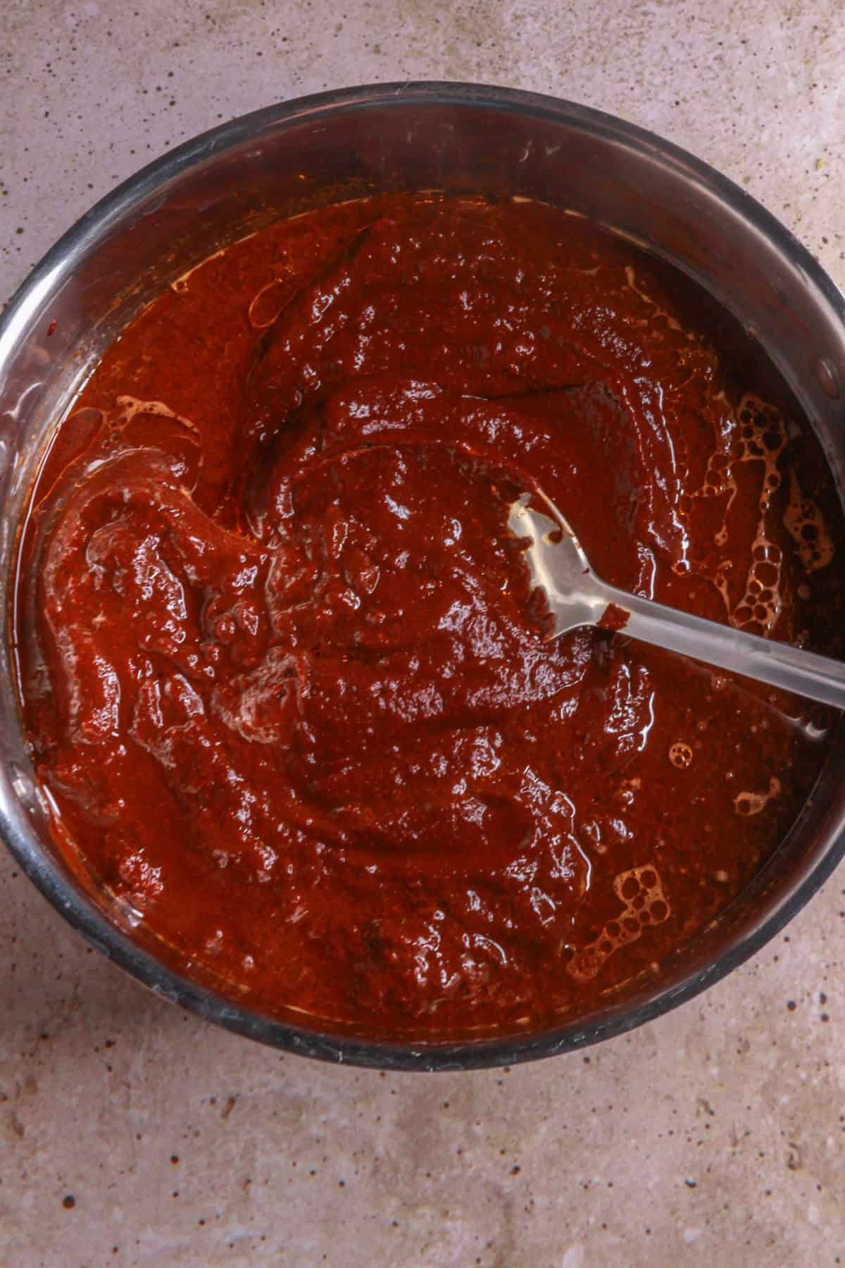 Frying mole sauce in a pan