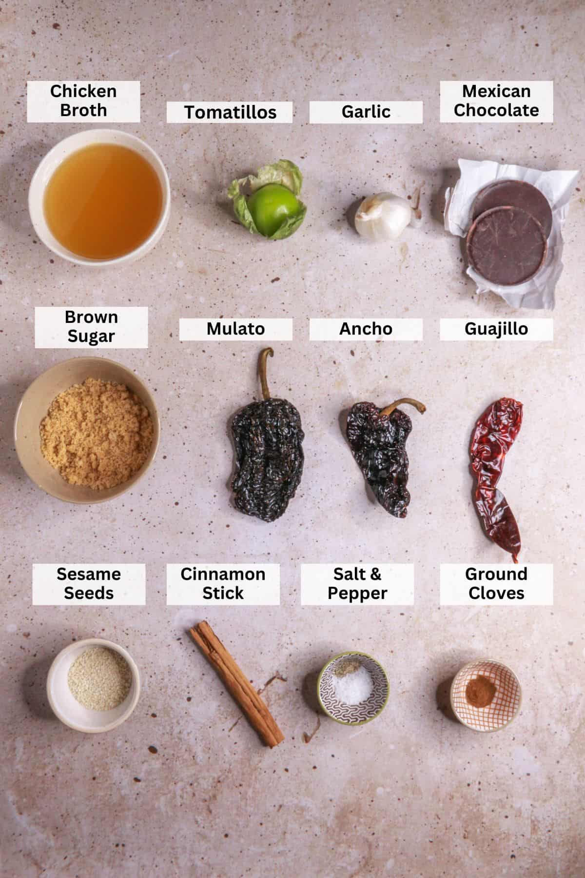 Ingredients for mole poblano: chicken broth, tomatillos, garlic, Mexican chocolate, brown sugar, ancho chiles, mulato chiles, guajillo, sesame seeds, cinnamon stick, salt and pepper, ground cloves