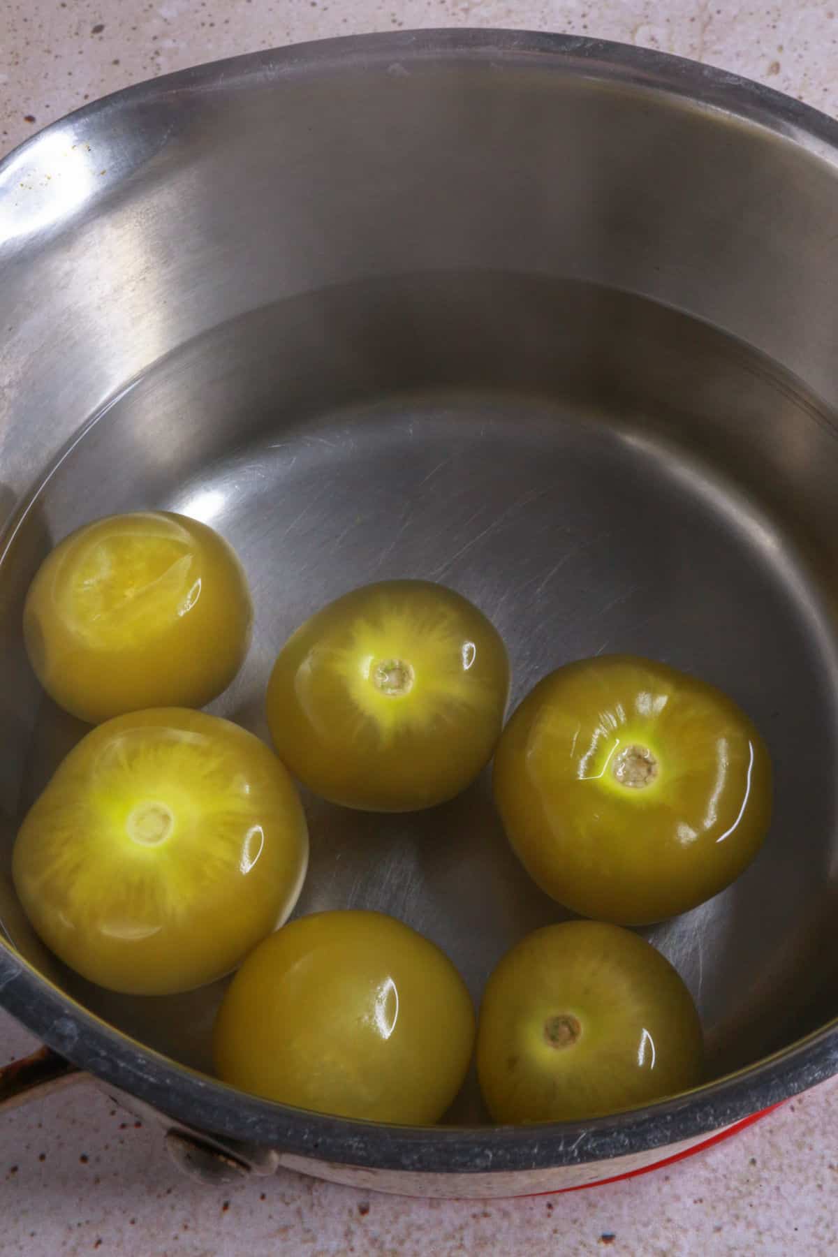 cooked tomatillos in water