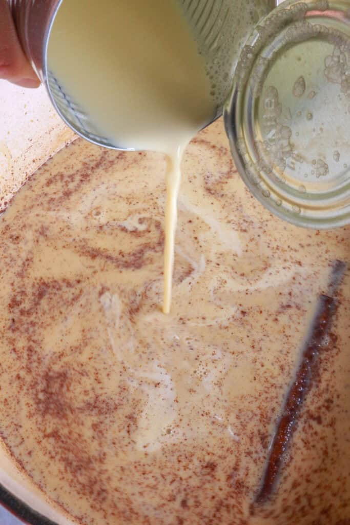 Adding chocolate and milk to pot