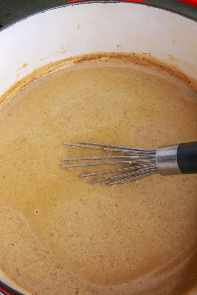 Mix ingredients together for champurrado in a pot