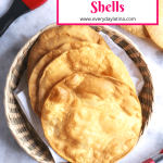 Tostada shells on a white background with red tongs and pastry brush