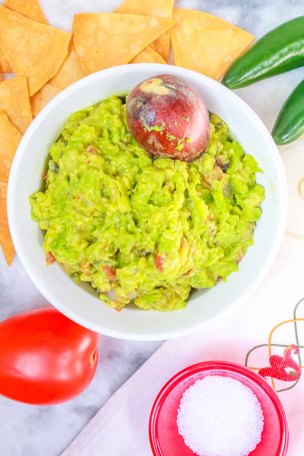 Fire Roasted Guacamole surrounded by tortilla chips and vegetables