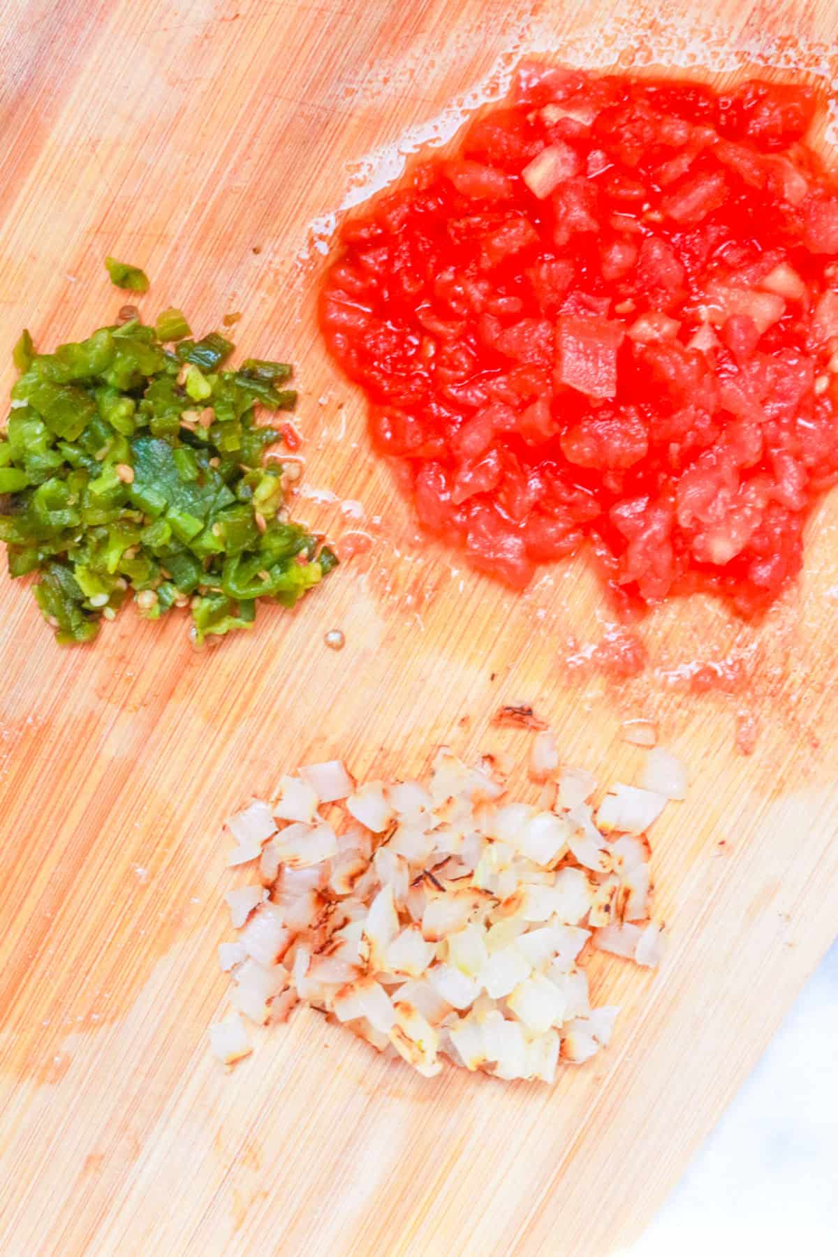 Diced roasted vegetables on cutting board