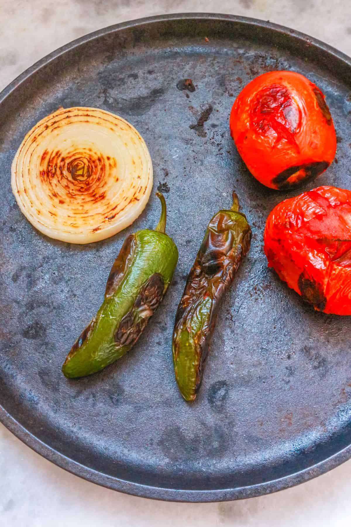 Roasting vegetables on a comal
