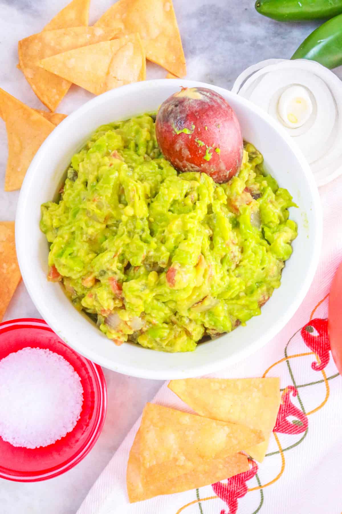 Fire Roasted Guacamole surrounded by tortilla chips and vegetables