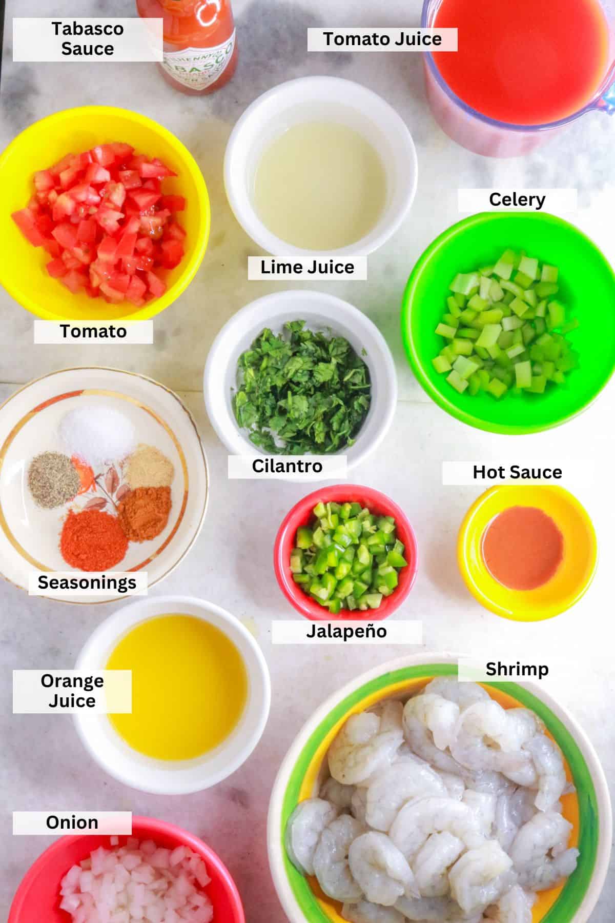 Ingredients for coctel de camarón: tomato, lime juice, celery, tabasco sauce, tomato juice, seasonings, cilantro, hot sauce, jalapeño, orange juice, shrimp