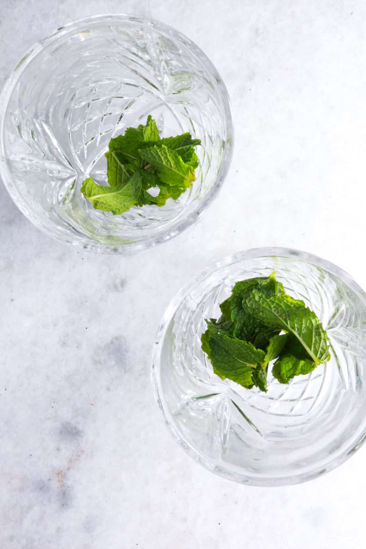 Two glasses with fresh mint leaves