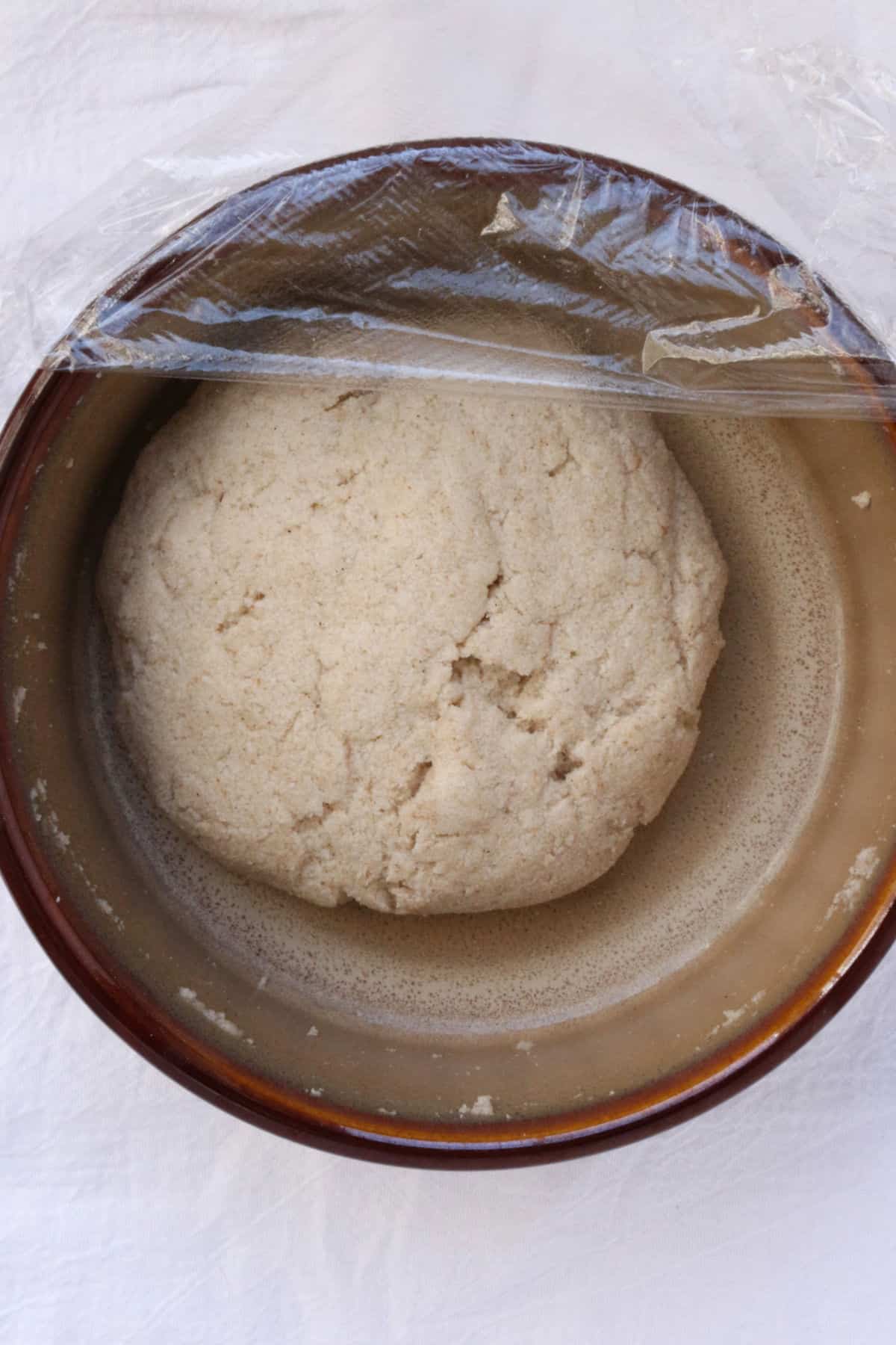 A ball of gluten-free dough for empanadas in a bowl