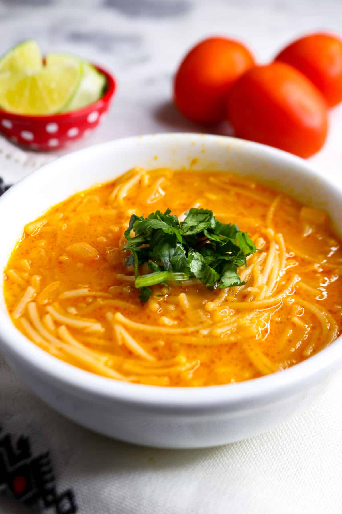 Bowl of gluten-free Mexican fideo soup garnished with cilantro