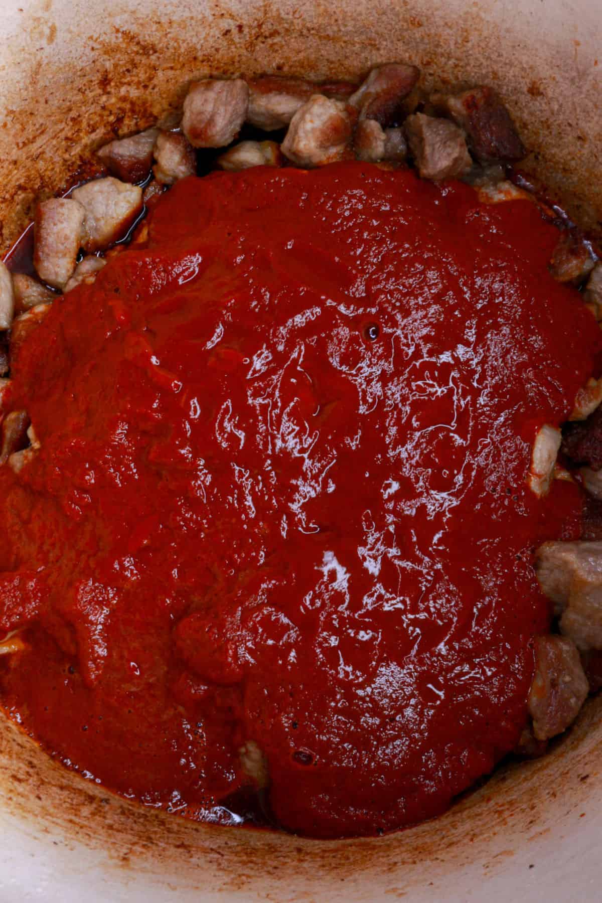 Asado de puerco sauce poured over cooked pork