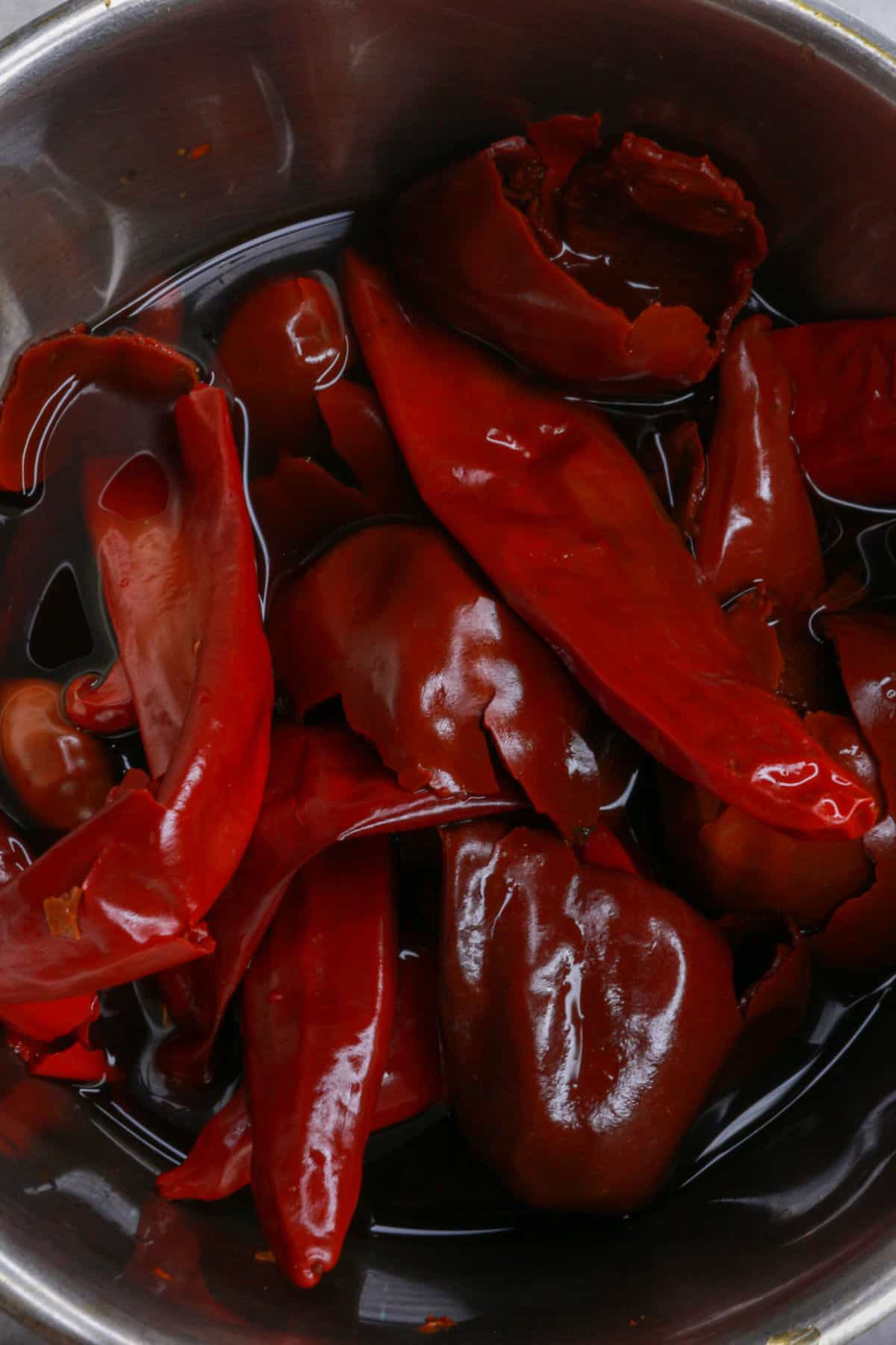 Boiling dried red chiles in a pot of water