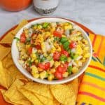 Roasted corn pico de gallo surrounded by tortilla chips