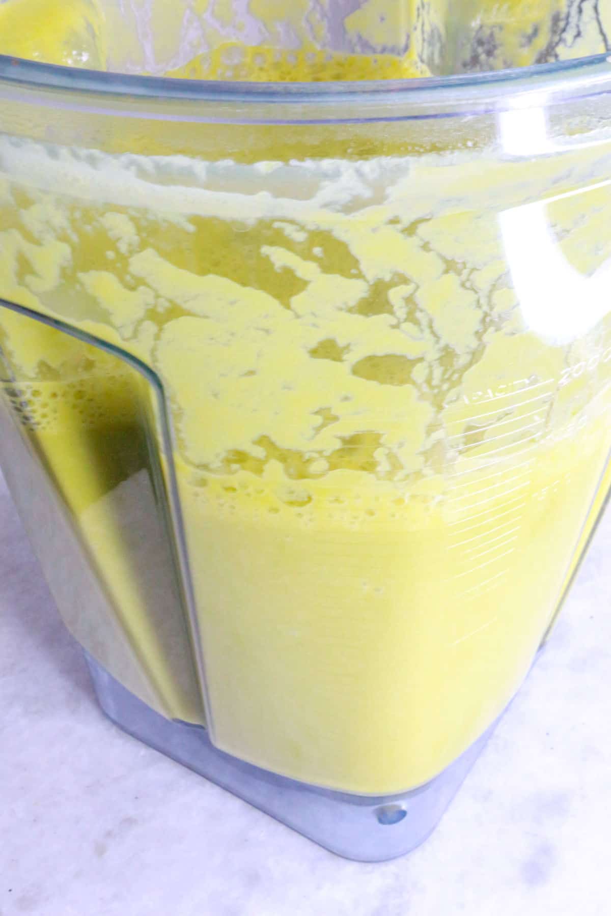 Blender with blended cream of asparagus soup