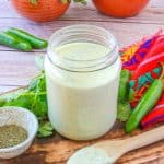 Jar of homemade creamy serrano ranch dressing