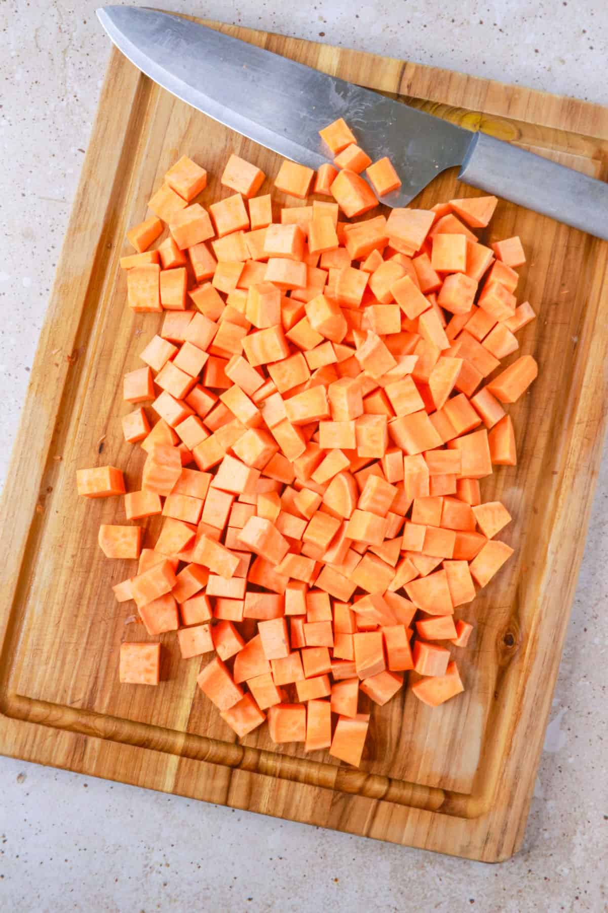 diced sweet potatoes on cutting board