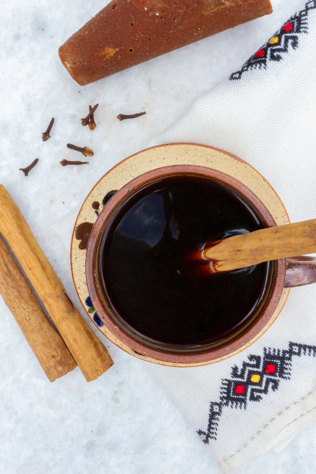 Authentic Cafe de Olla Recipe, bird's eye of a coffee in a mug with a cinnamon stick