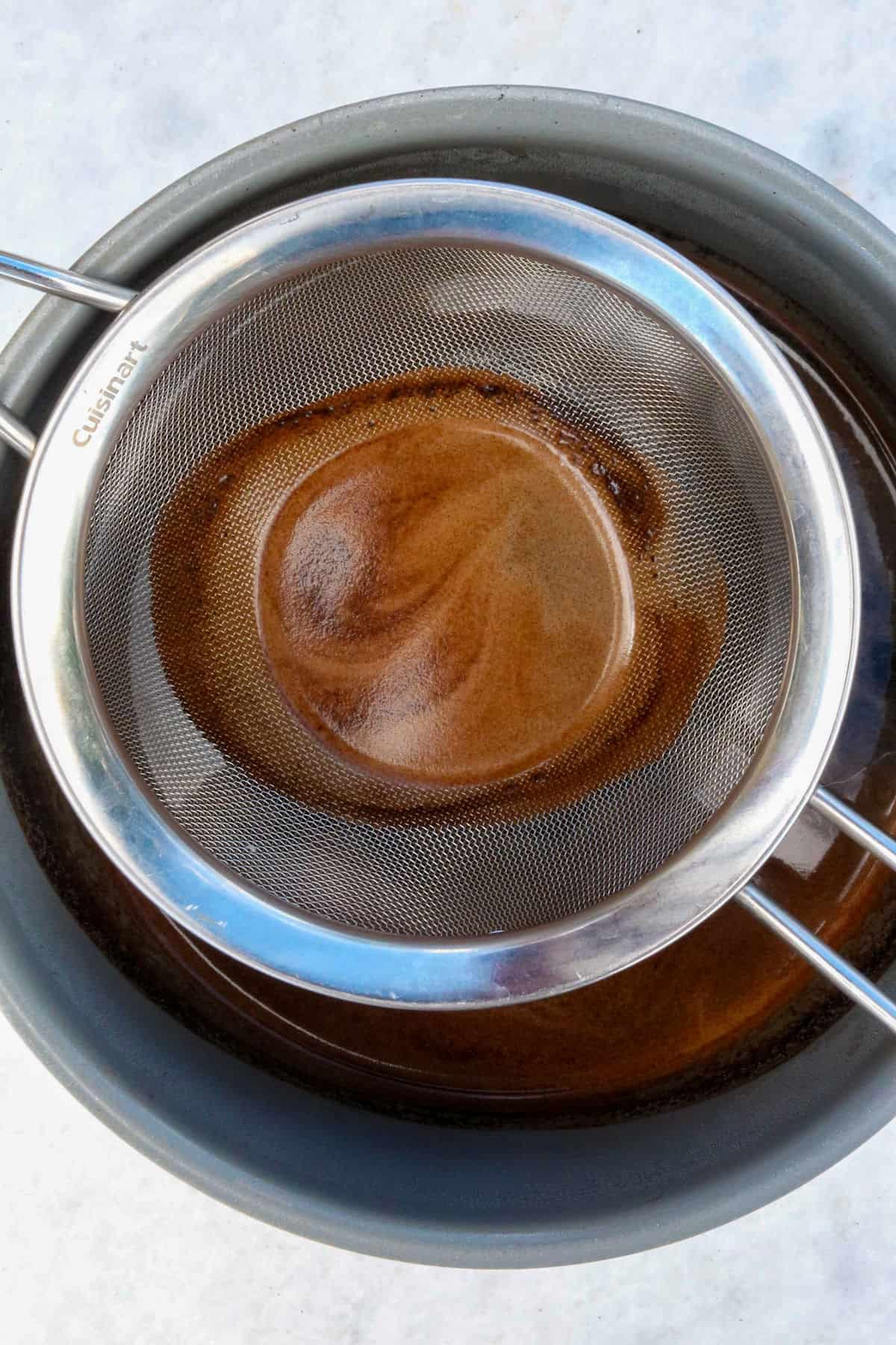 Mesh strainer in a pot to strain coffee