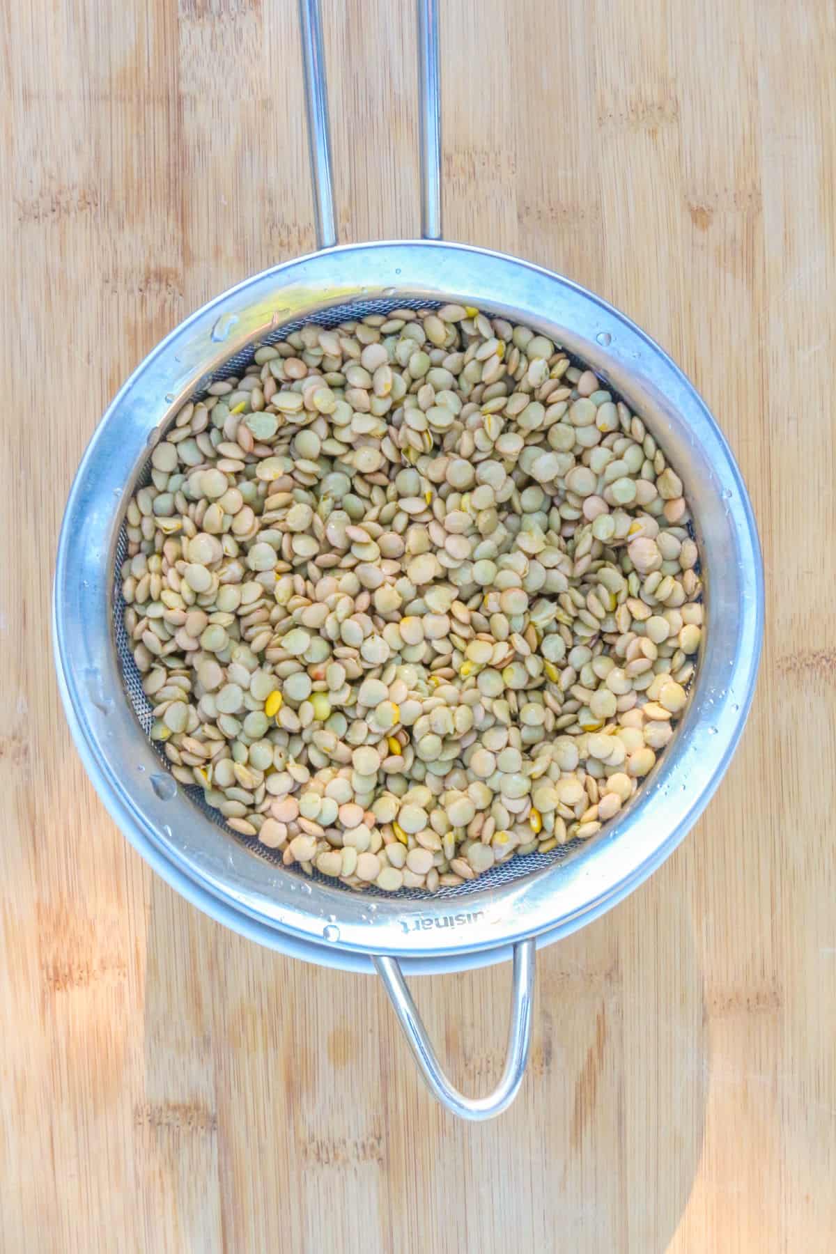Draining lentils in a mesh strainer