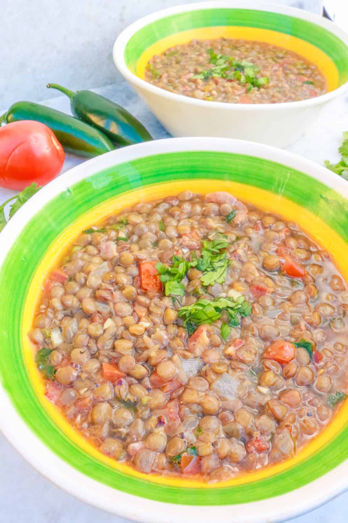 Two bowls of Mexican Lentil Soup (sopa de lentejas)
