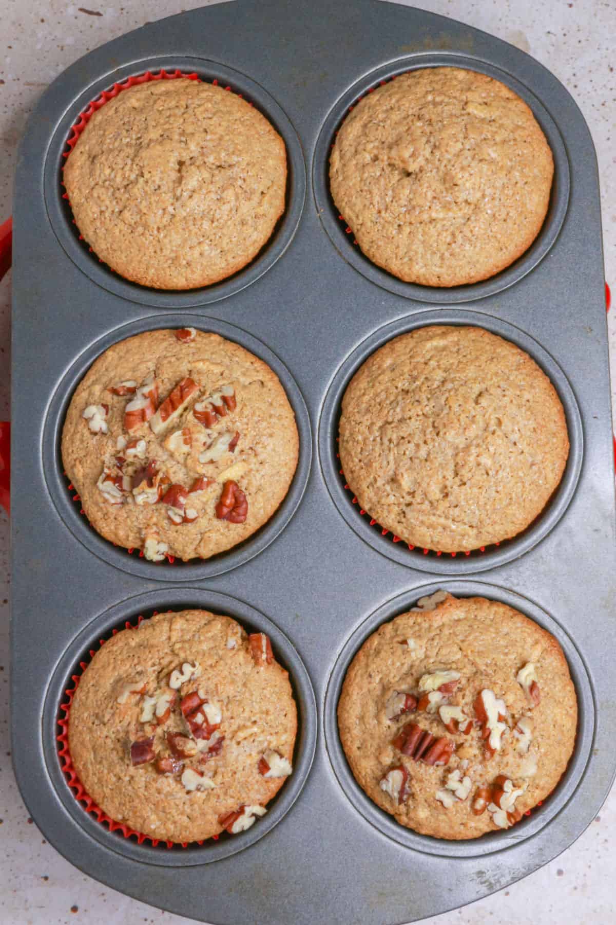 Baked apple muffins in muffin tin