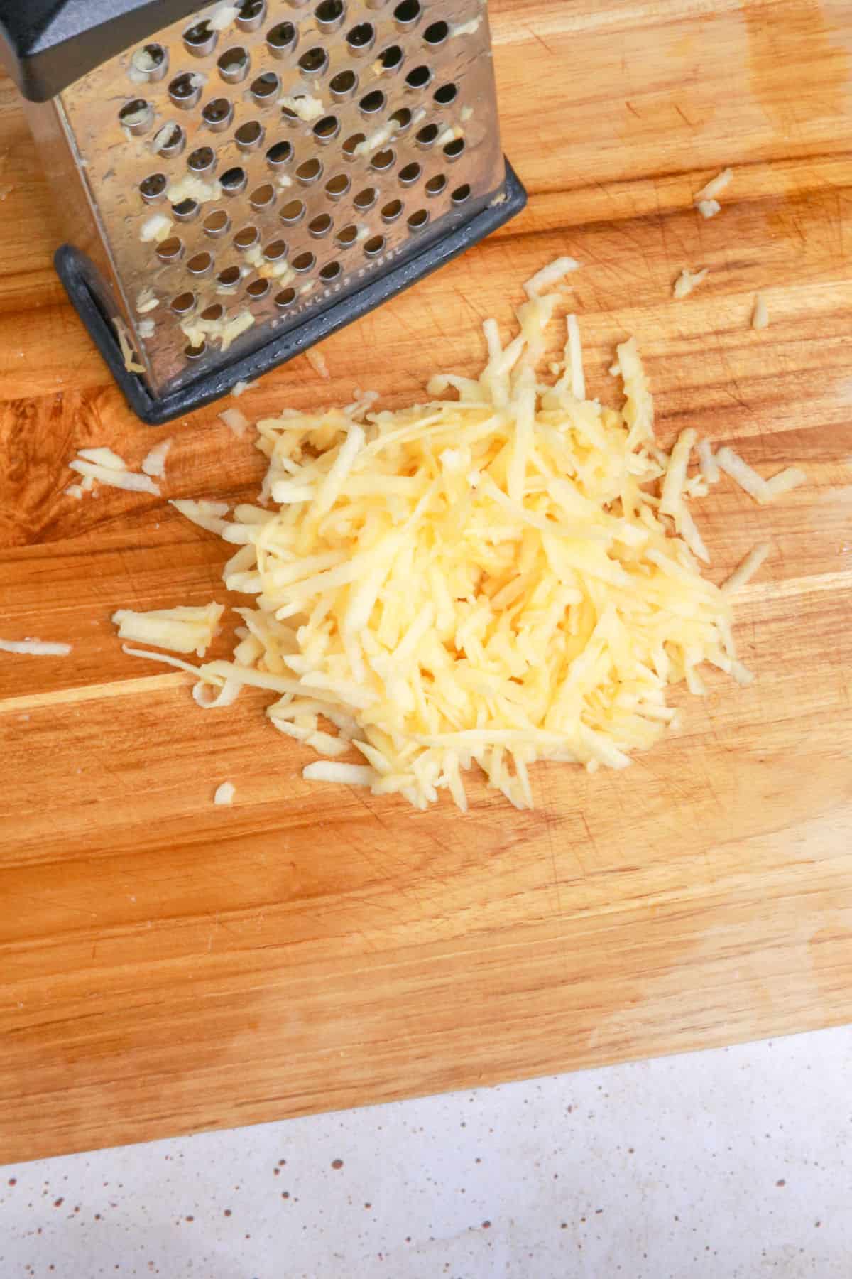 Grated apple on a cutting board