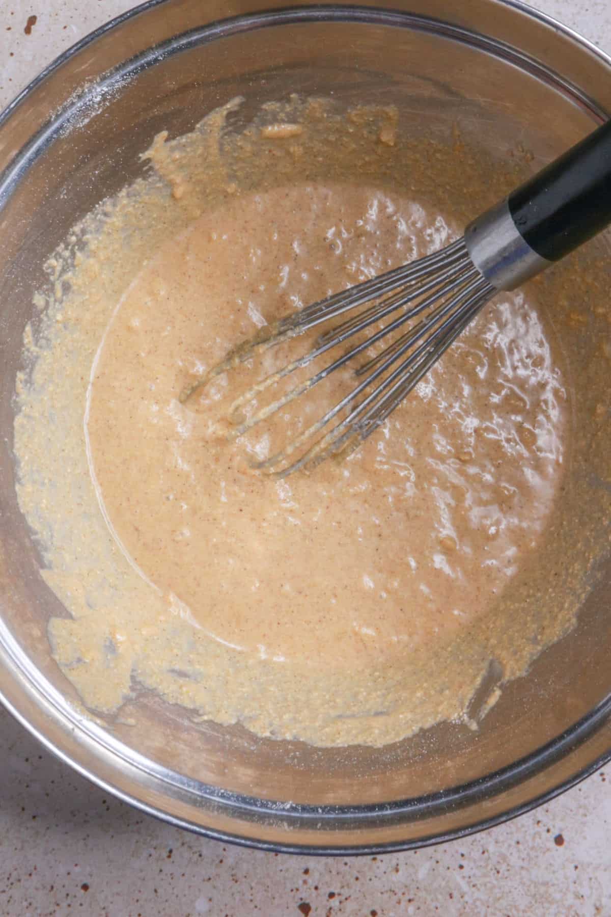Mixing batter with whisk in a bowl