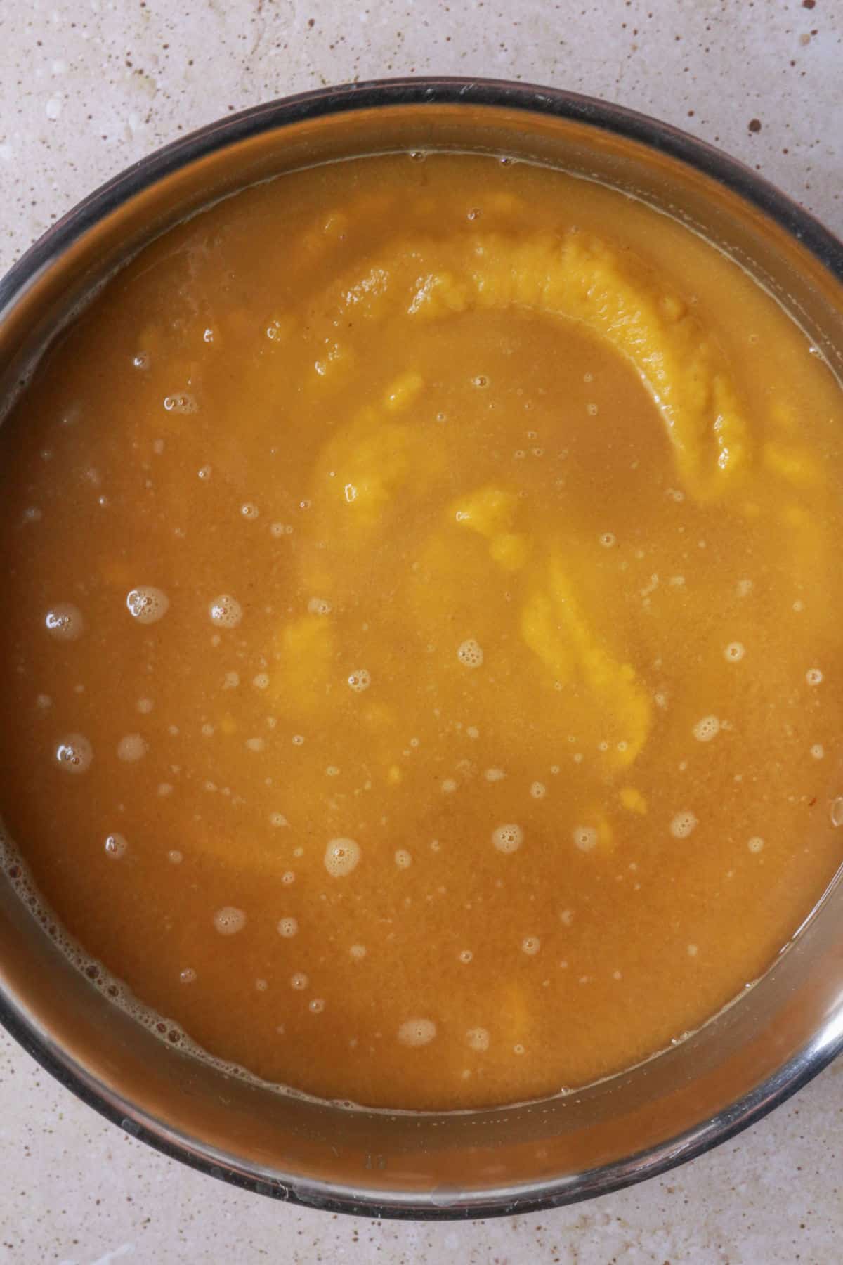 pumpkin puree mixture mixed into the pan with cinnamon water