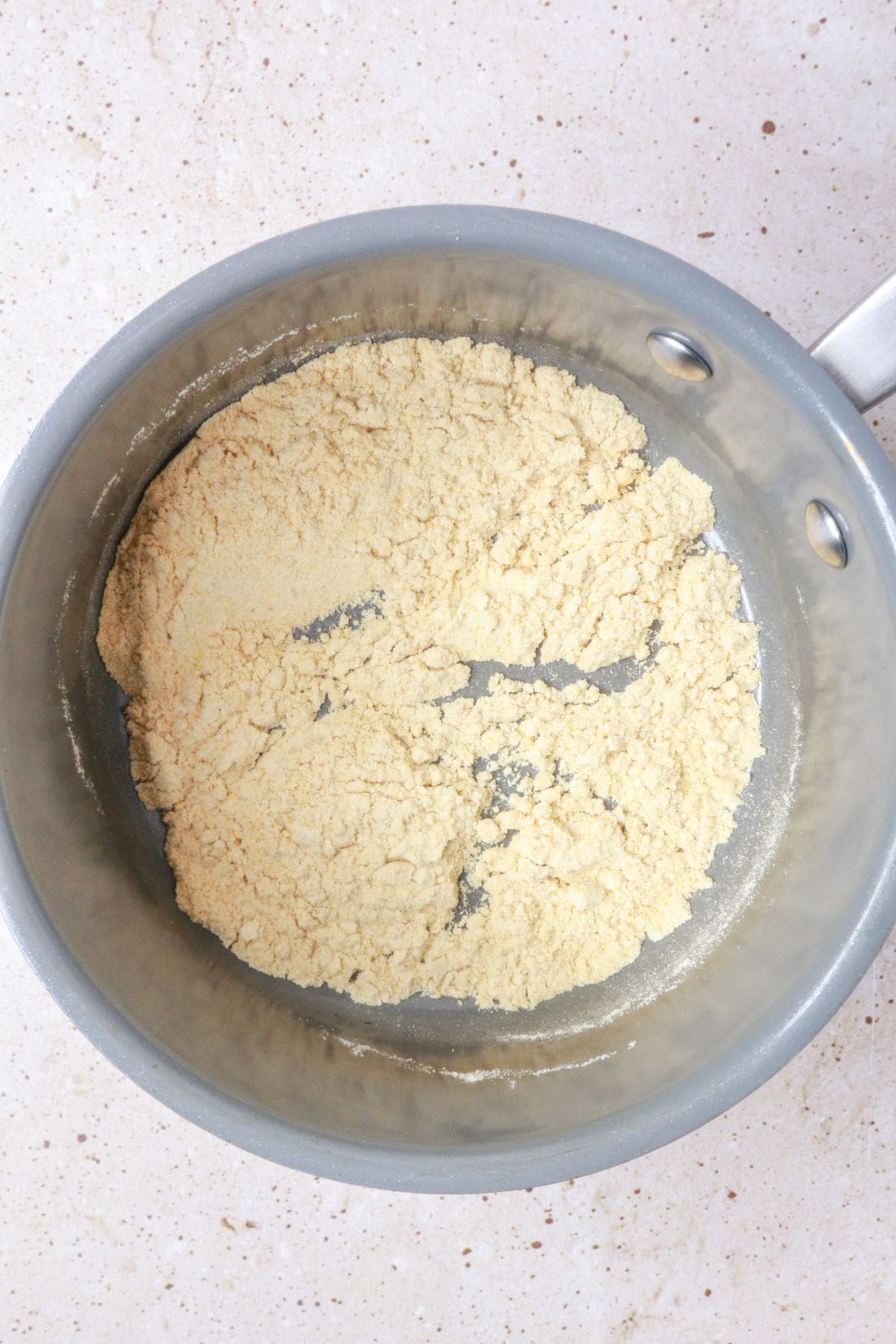toasting masa harina in a pan