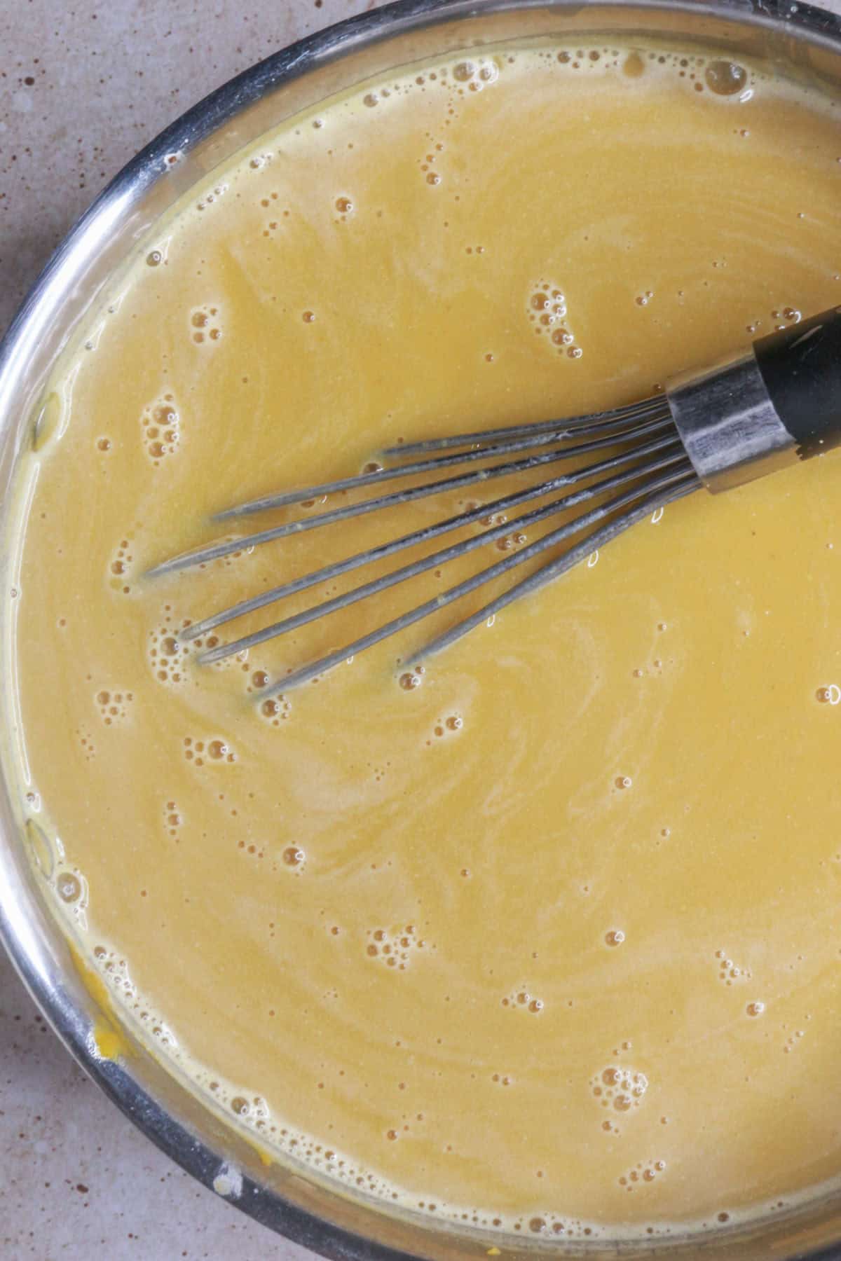 whisking pumpkin atole