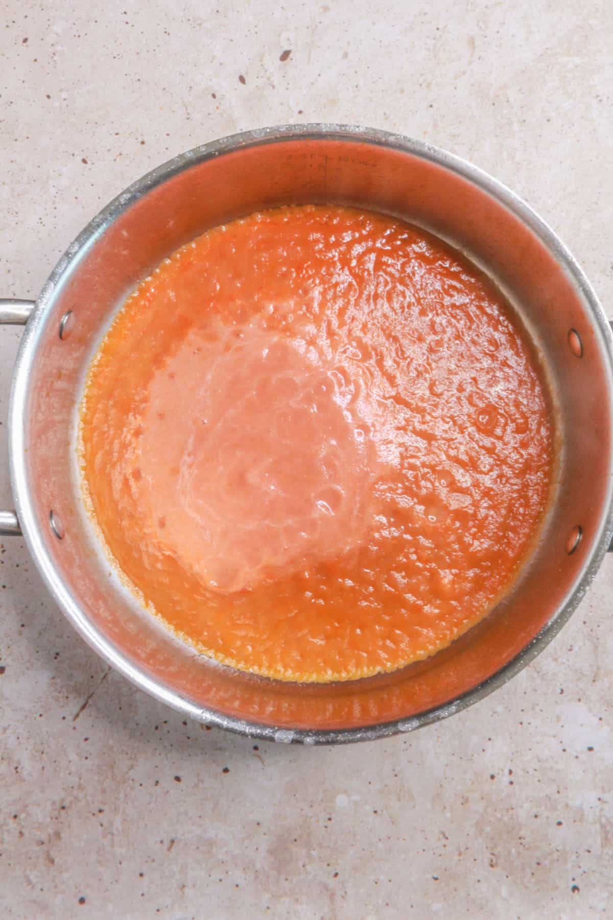 Tomato base sauce cooking in a little oil