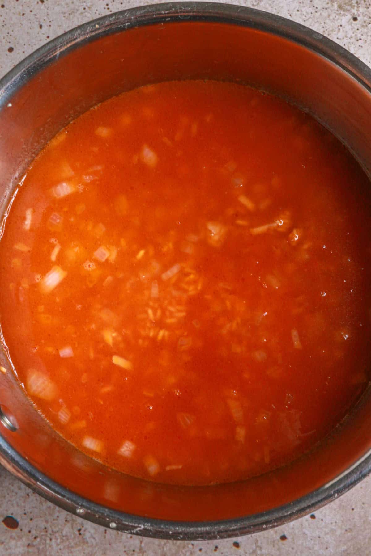 Add broth, tomato sauce and salt