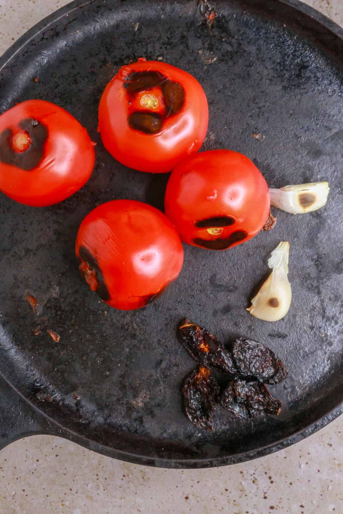 Roasting tomatoes and toasting chiles and garlic cloves