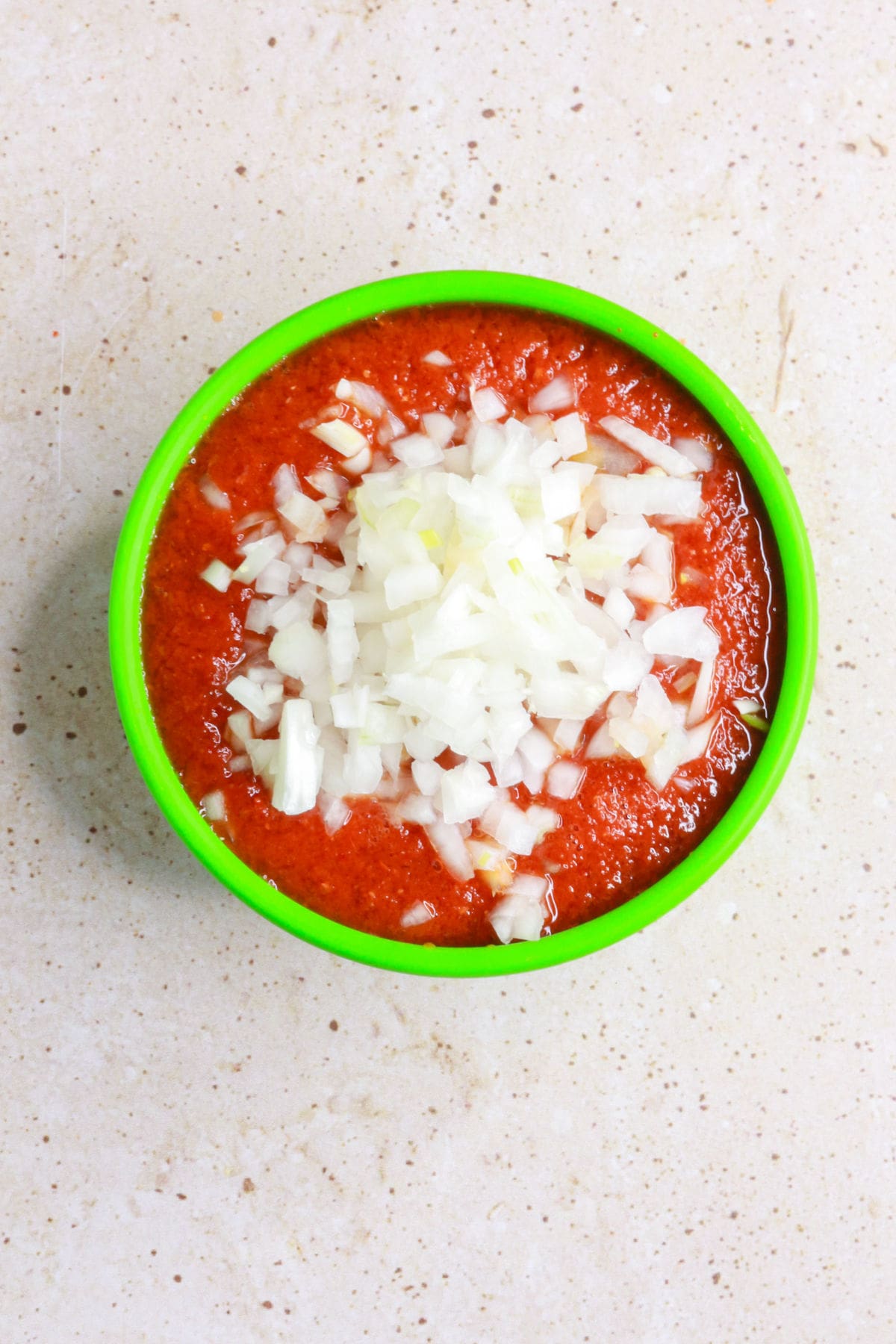 Salsa in salsa bowl with diced onion