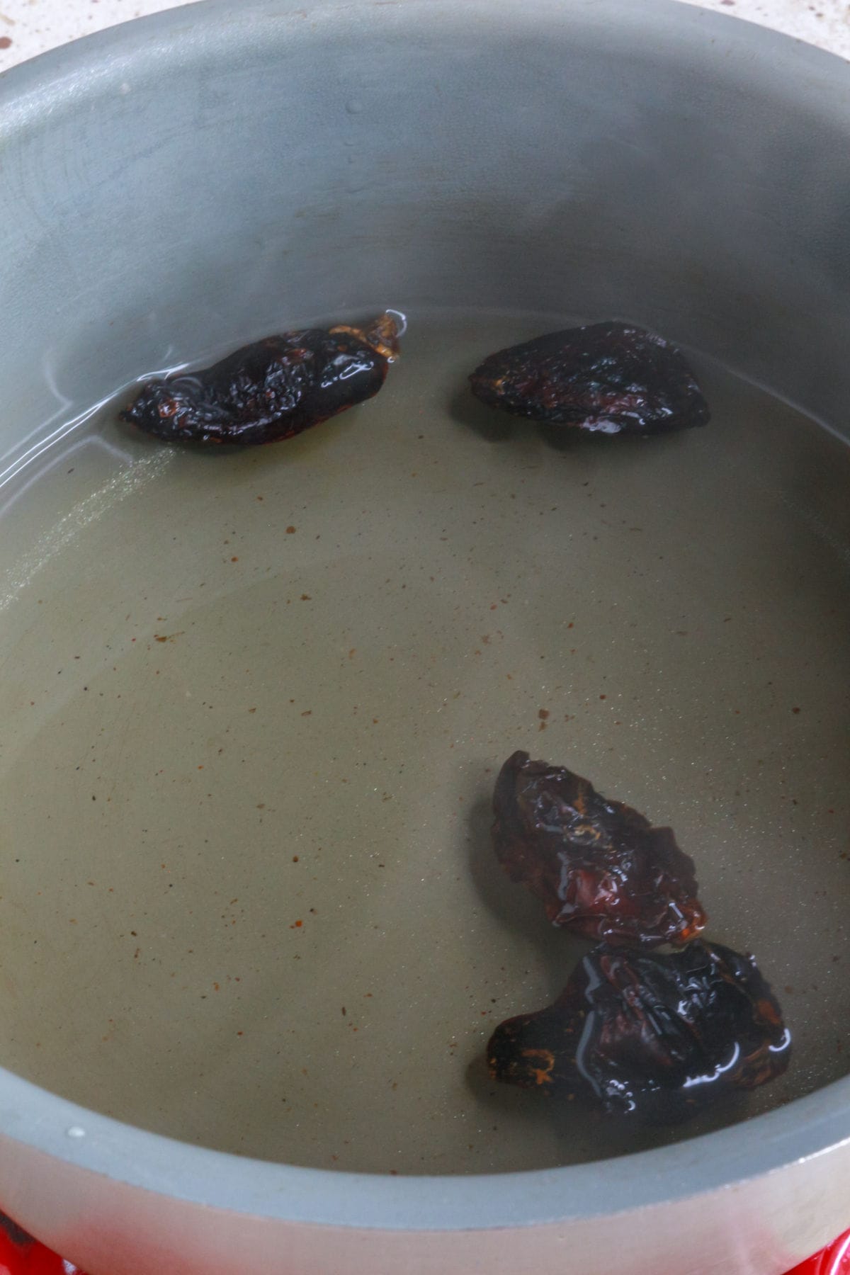 Soaking chile morita in water