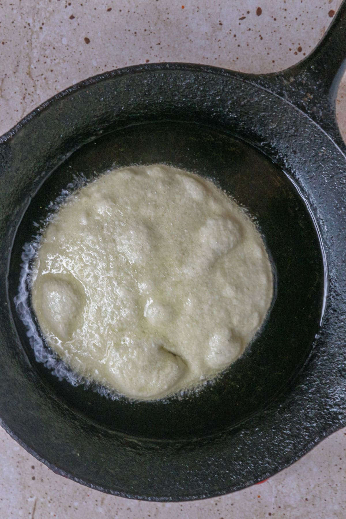 Slightly fry tortillas until pliable