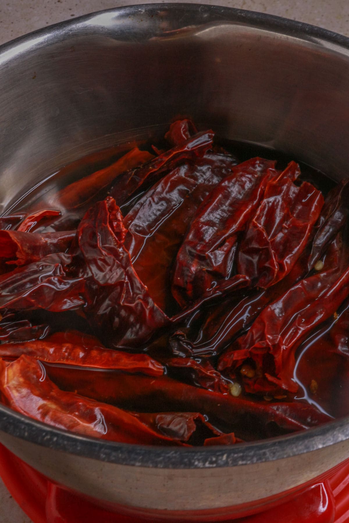 Boiling dried guajillo and arbors chiles to soften