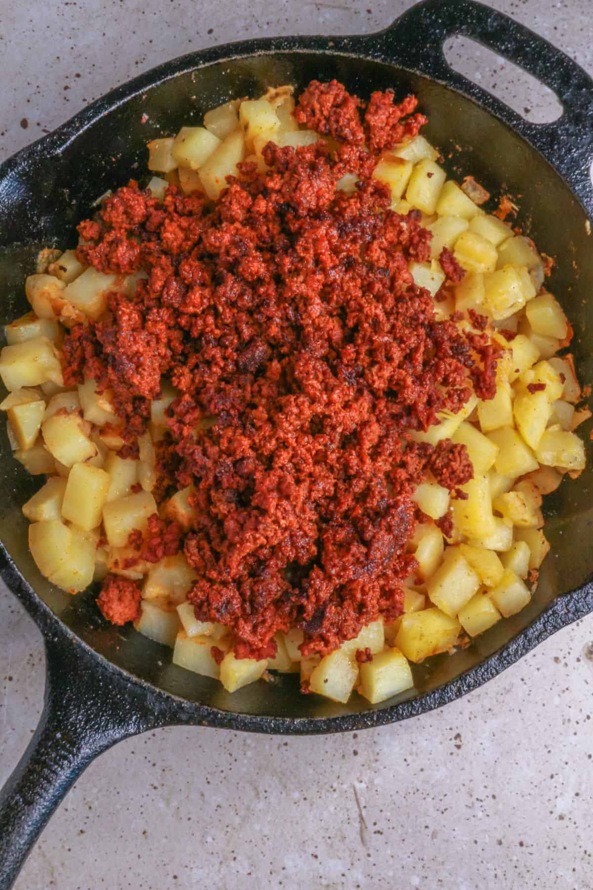 Cooked chorizo added to cooked potatoes