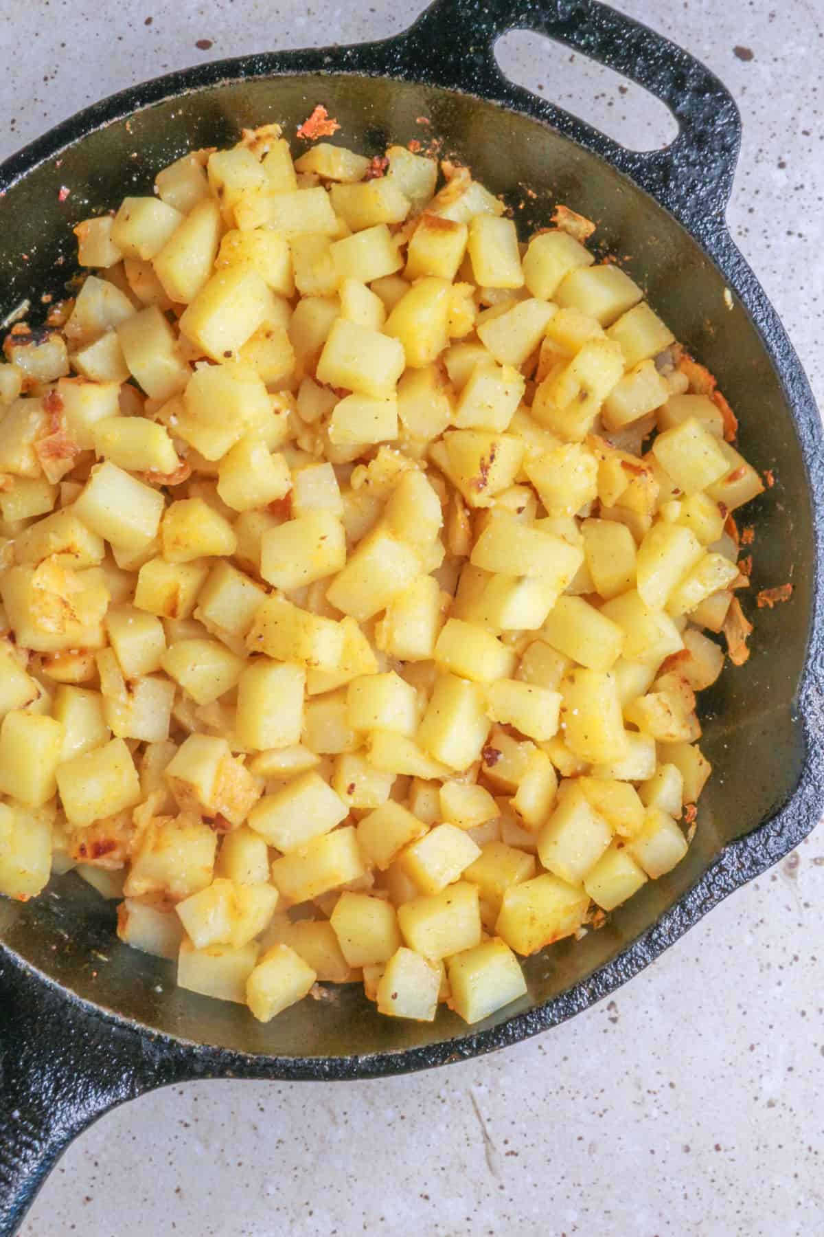 Cooked potatoes in cast iron skillet