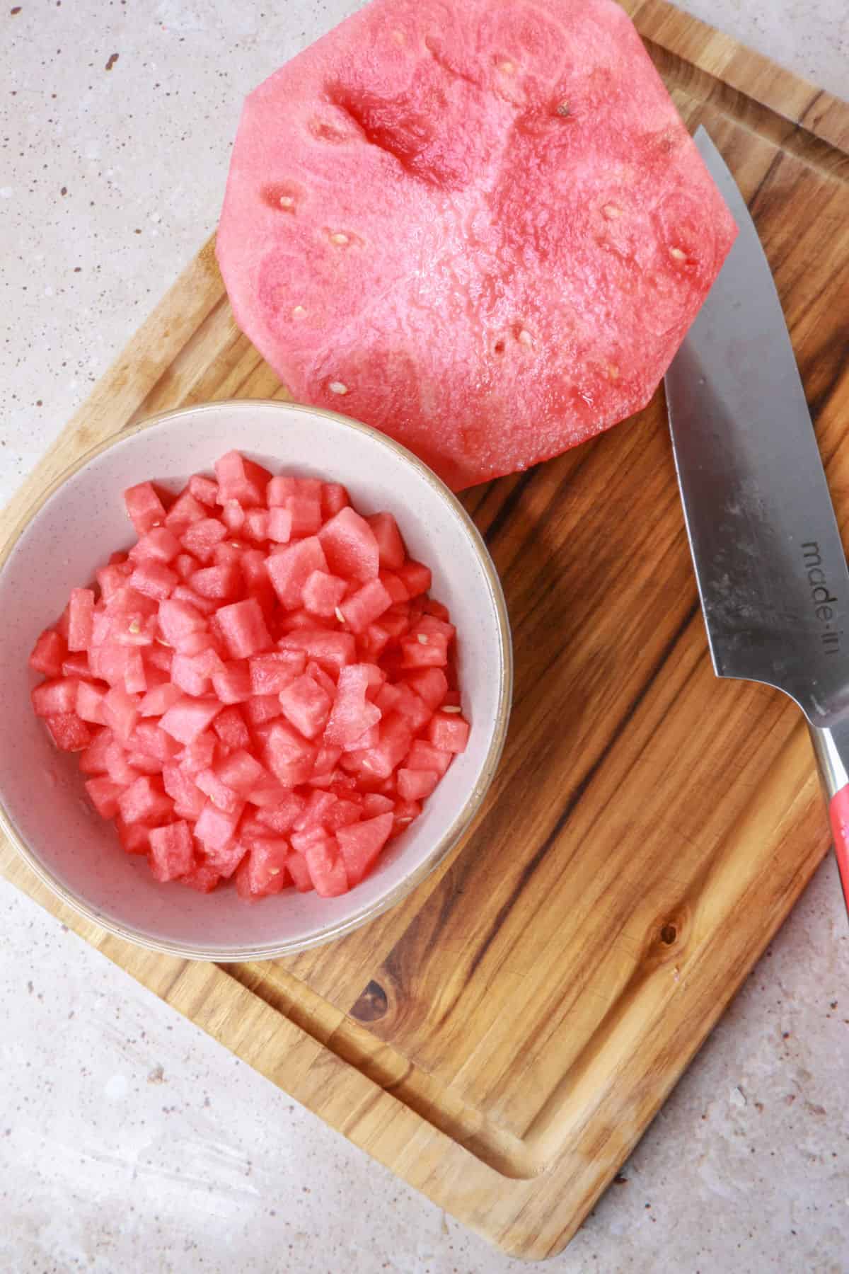 Diced watermelon on cutting board