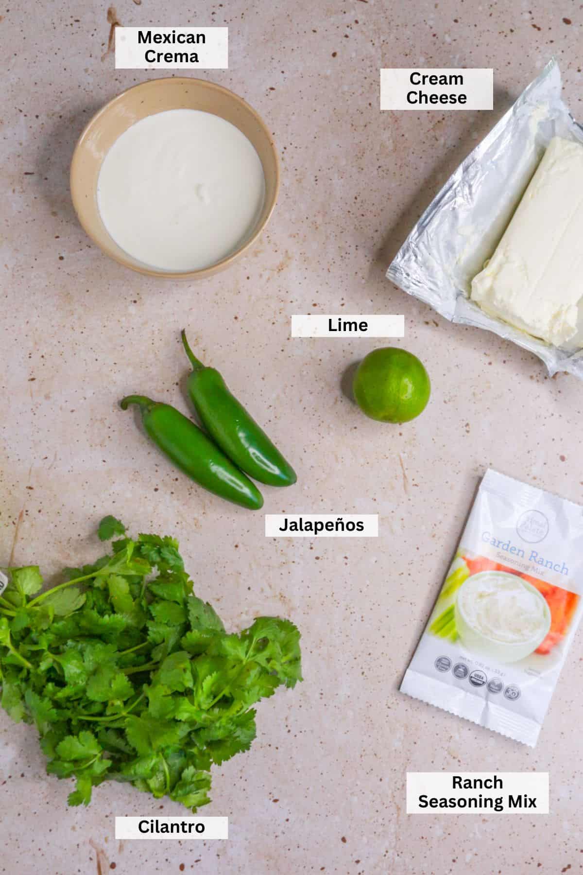 Ingredients for jalapeño ranch dip: Mexican crema, cream cheese, jalapeños, lime, cilantro, ranch seasoning mix