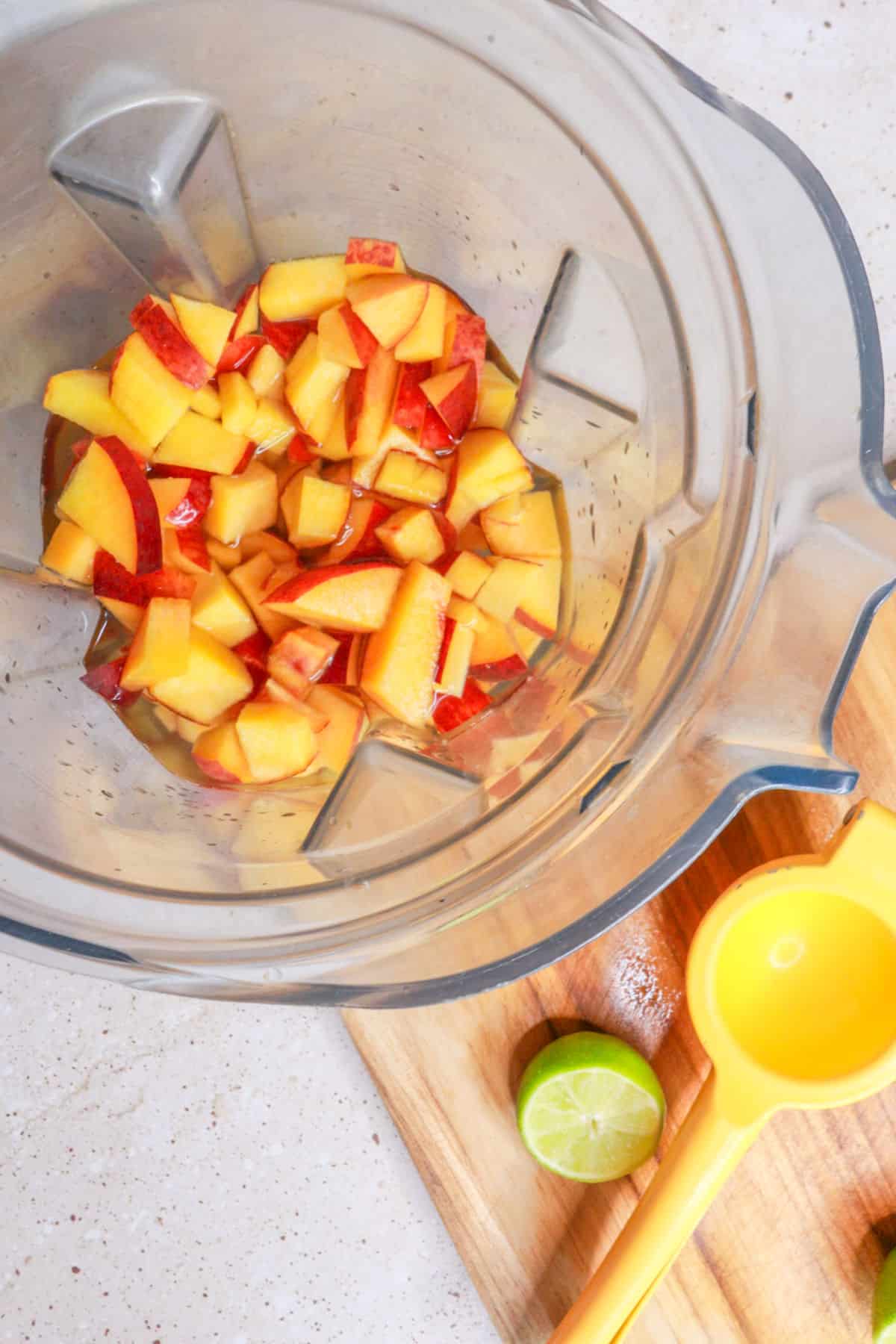 Peaches, water and lime juice in blender