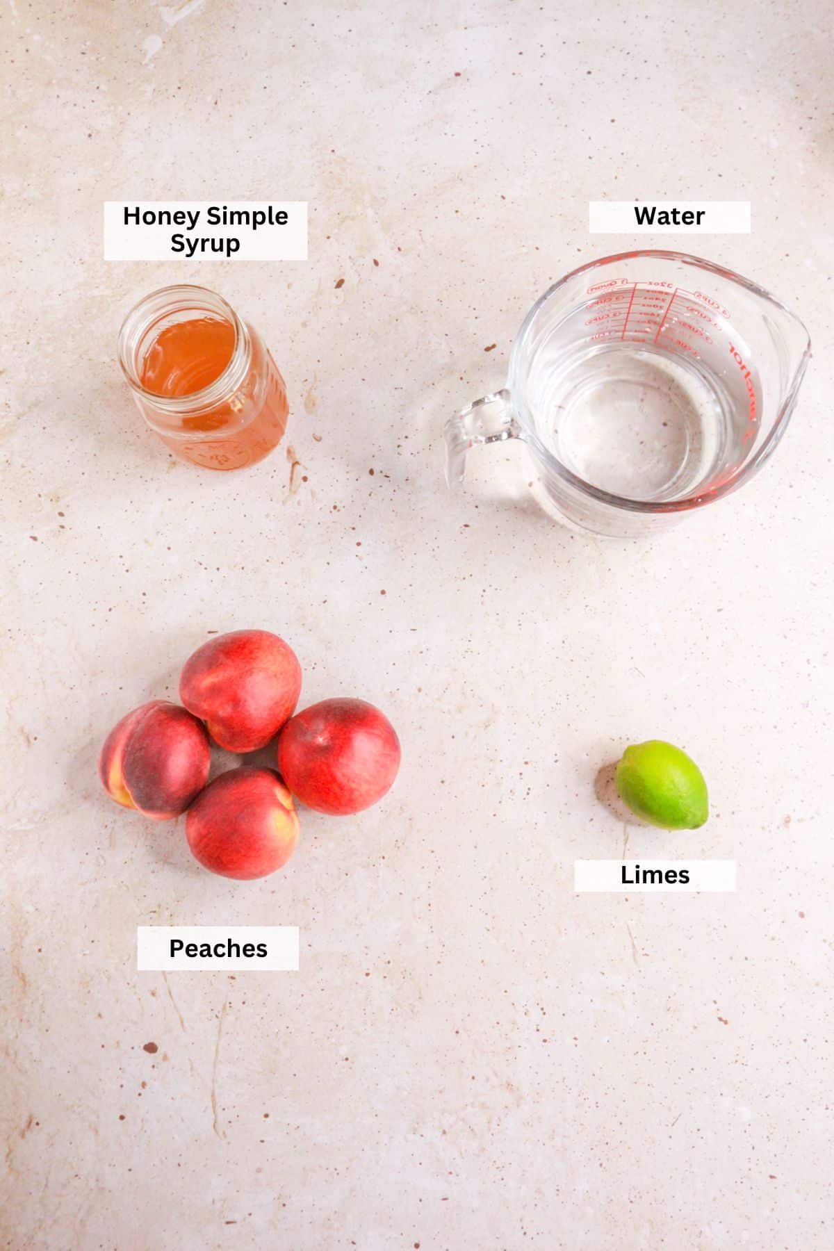 Ingredients for agua de durazno: peaches, water, honey simple syrup, limes