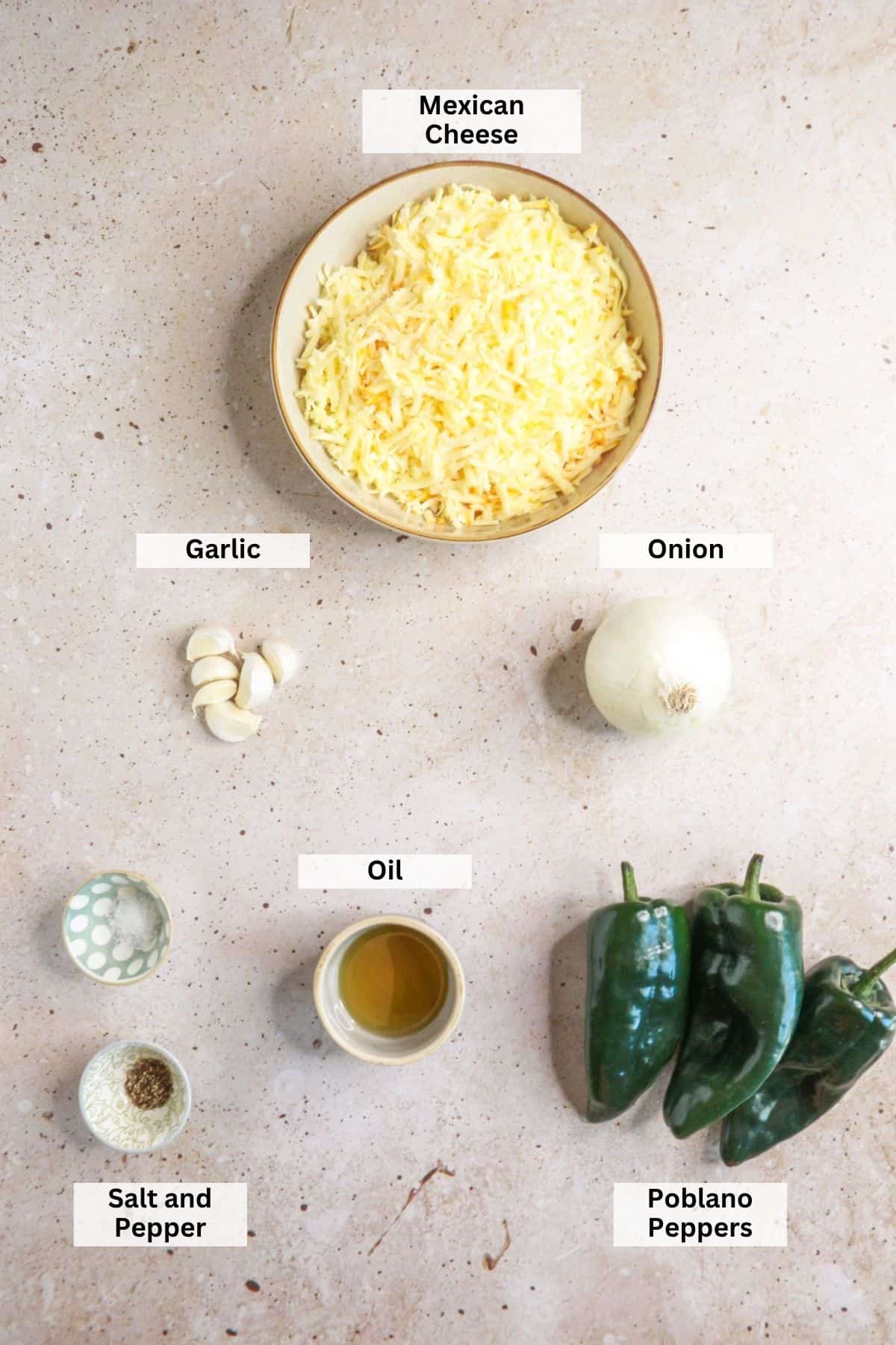 Ingredients for roasted poblano queso fundido: Mexican cheese, garlic, onion, salt and pepper, oil, poblano peppers