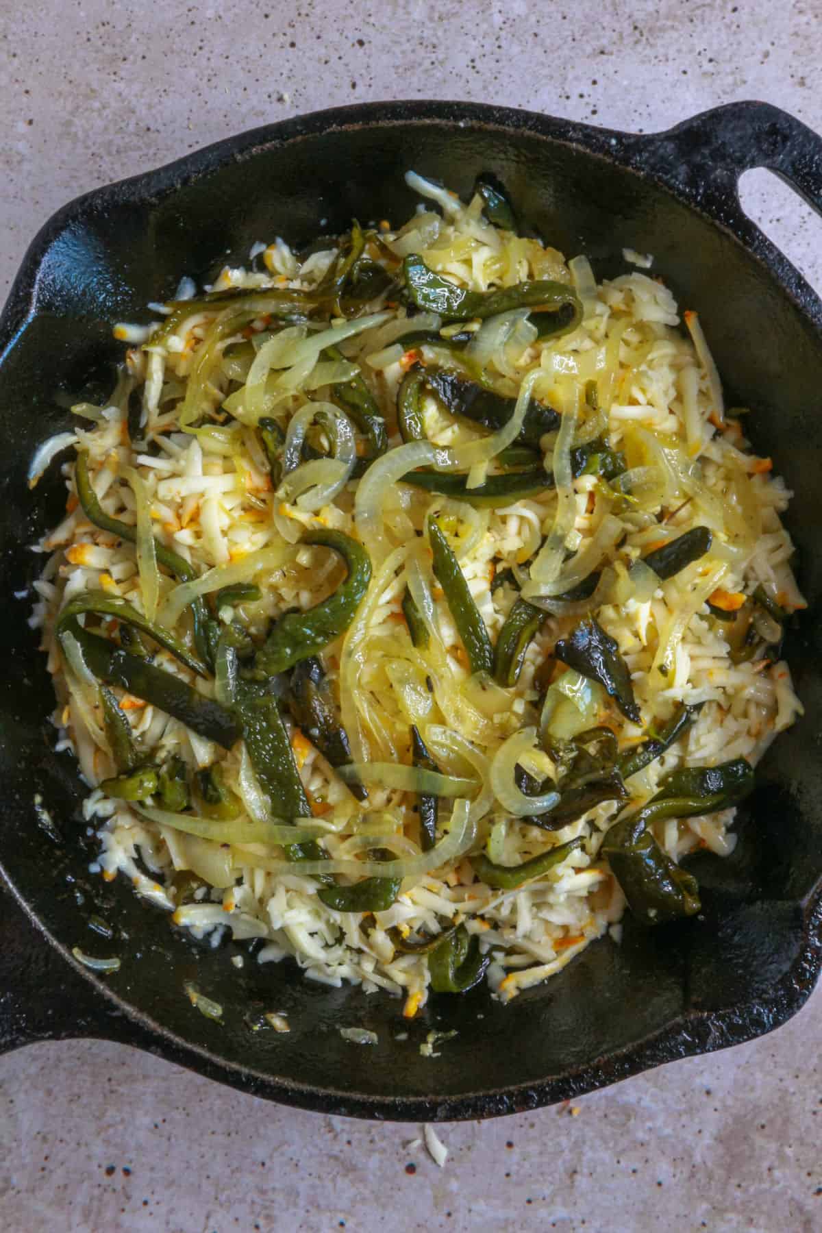 layered cheese, poblano, onion, and garlic mixture