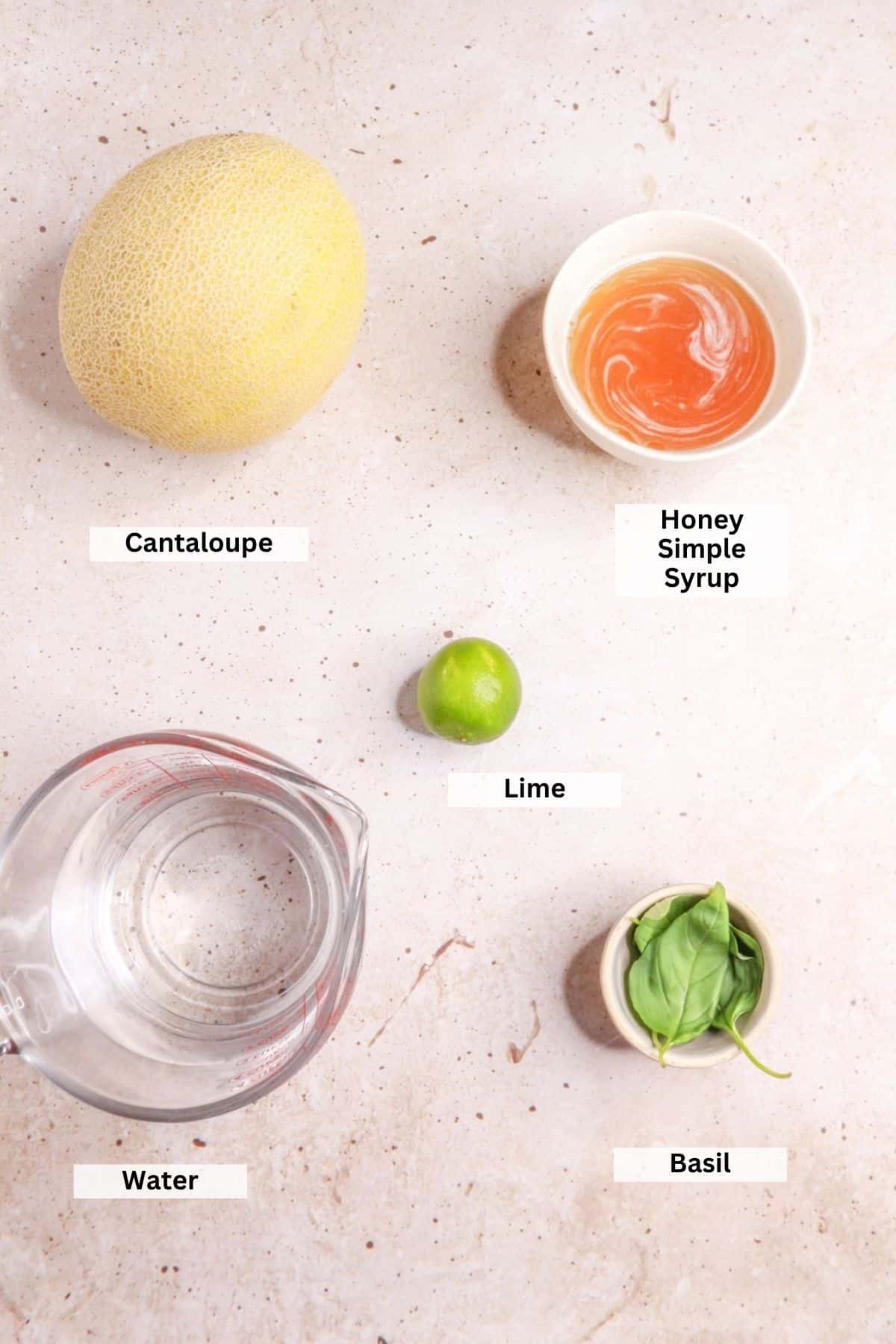 Ingredients for cantaloupe basil agua fresca: cantaloupe, honey simple syrup, lime, water, basil